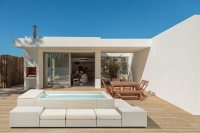 Modern house with garden swimming pool and wooden deck