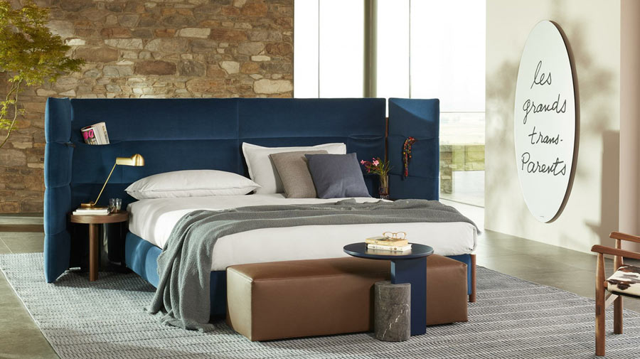 The extra-large headboard restyles the bedroom